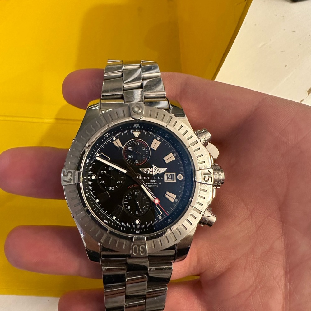 Breitling Super Avenger with its original box, certifications, warranty cards.
